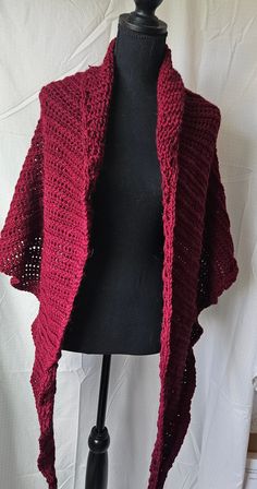 Maroon, wide triangle wrap or shawl. It can be worn multiple ways - as a wrap, tied shawl, or a thick scarf.  It is very soft and warm, perfect for chilly fall days or warmer winter ones. It is a pretty maroon/red color which would look great at holiday parties. It is crochetted with Made with Touch of Alpaca yarn by Lion Brand. 90% Acrylic/10% Alpaca. It is safe to machine wash but would do best if laid flat to dry. It is 92" across at the top and 25" at longest point. Lovingly made in my Texas home - proceeds help me continue to care for the critters who call our farm home. Maroon Red Color, Thick Scarf, Fall Days, Alpaca Yarn, Maroon Red, Lion Brand, Autumn Day, Shawls And Wraps, Warm Winter