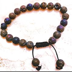 Awesome Lava Rock Bracelet, Adjustable Too! Has Lots Of Pretty Colors In The Rocks In Different Lighting. Bundle And Save! Brand New No Attached Tag. Thanks For Looking At My Closet! Have A Happy, Safe, & Blessed Day. Adjustable Natural Stone Beaded Bracelets For Vacation, Casual Beaded Bracelets With Natural Stones For Beach, Casual Beach Beaded Bracelets With Natural Stones, Casual Beaded Bracelets With Natural Stones, Casual Adjustable Bracelets With Natural Stones, Adjustable Purple Beaded Bracelets Casual Style, Adjustable Casual Purple Beaded Bracelets, Casual Adjustable Purple Beaded Bracelets, Casual Brown Beaded Bracelets For Vacation