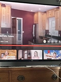 a flat screen tv sitting on top of a wooden dresser next to a kitchen counter