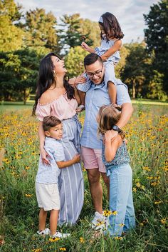 a family standing in the middle of a field