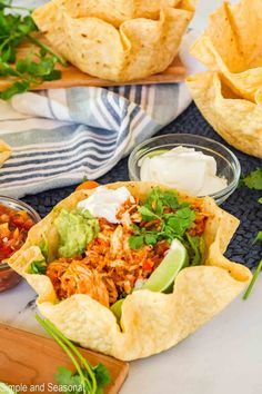 mexican food with tortilla chips, salsa and guacamole on the side