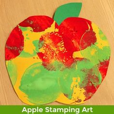 an apple stamping art project for kids