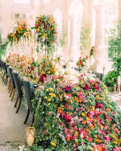 a long table covered in lots of flowers