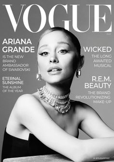 the front cover of a magazine with a woman in black dress and jewelry on it