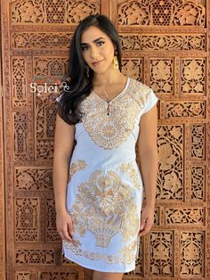 This Beautiful Mexican Gold Floral Dress is the perfect dress for a fun night out or a special event. It's made out of cotton and is full of gold embroidered details. This dress has ties on the back for an adjustable fit. The earrings you can buy too and you can find here https://www.etsy.com/es/listing/637147293/filigrana-redonda-filigrana-clasica?ref=shop_home_active_1&pro=1&frs=1 Fitted V-neck Dress With Embroidered Neckline, Festive Gold Dress With Chikankari Embroidery, Gold Floral Embroidery Dress For Spring, Gold Embroidered V-neck Dress, Spring Wedding Dress With Gold Embroidery, Fitted Gold Dress With Chikankari Embroidery, Traditional Gold Embroidered Dresses, Short Sleeve Embroidered Dress For Festive Wedding, Festive Embroidered Short Sleeve Dress For Wedding