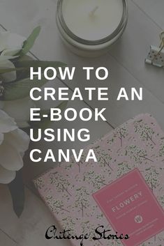 an e - book is sitting next to a candle and flowers on a table with the title how to create an e - book using canva