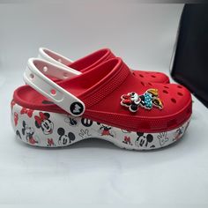 These Super Cute Women's Crocs Disney Minnie/Mickey Classic Platform Clogs In Size 8 With A Slip-On Design, These Clogs Feature A Round Toe Shape And A Low Top Shoe Shaft Style, Making Them Perfect For Everyday Wear And Travel. The Multicolor Clogs Are Adorned With Disney's Minnie And Mickey Mouse Pattern And Jibbits Accents, Adding A Playful Touch To Your Outfit. The Rubber Outsole And Insole Materials Provide Comfort, Breathability, And Lightweight Features, Making Them Suitable For All Season Casual Mickey Mouse Clogs With Round Toe, Crocs Platform Clog, Crocs Platform, Mickey Mouse Pattern, Womens Crocs, Mouse Pattern, Minnie And Mickey, Fancy Clothes, Clogs Style