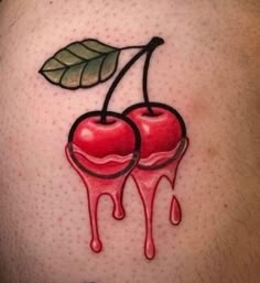 a man's stomach with two cherries dripping from them