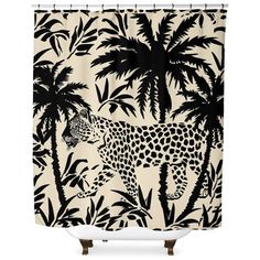 a shower curtain with a leopard and palm trees