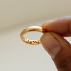 RHETA RING The simplicity and elegant crafted Personalized Name Medium Band Ring is the perfect symbol of love and devotion for your special day! Handmade 18k gold vermeil materials, with it's smooth gold accents and personalized engraved lettering. Give it your perfect tough by adding your name, initials, or even a special date. This ring is a sophisticated and meaningful gift to give to yourself, your beloved one, or another important person in your life.  -- If you would a thinner version, you can find our Rhia Thin Band Ring below https://etsy.me/3P7JVXB -- If you would a bold version, you can find our Reina Thin Band Ring below *MATERIAL:  -- 100% Recycled Sterling Silver - This solid, precious metal is a classic that lasts forever. While it may darken over time, with continuous care Simple Gold Stackable Rings For Promise, Classic Gold Midi Rings For Promise, Timeless Stackable Engraved Ring For Anniversary, Classic Promise Couple Rings With Open Design, Classic Couple Promise Rings With Open Ring Design, Timeless Stackable Rings As Gift, Classic Engraved Midi Rings For Wedding, Classic 14k Gold Midi Rings For Promise, Classic Engraved Wedding Midi Rings