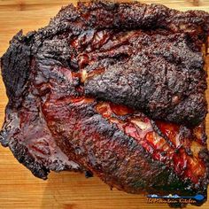 a piece of meat that is sitting on a cutting board