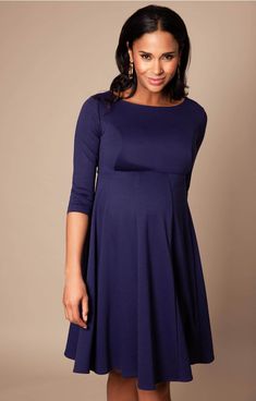 Cut to flatter throughout your pregnancy and after baby arrives too, the gently tailored shape of our Sienna Maternity Dress drapes beautifully over your curves with a soft panelled Ponte Roma skirt and neat princess seams to the bust. A classy and chic look that’ll never go out of style, this smart maternity dress in stylish navy blue is the perfect desk to dinner dress for your maternity wardrobe. Modest Maternity Dresses, Navy Blue Maternity Dress, Rose Tiffany, Blue Maternity Dress, Navy Maternity Dress, Dresses Dinner, Designer Maternity Clothes, Maternity Evening Dress, Maternity Wedding