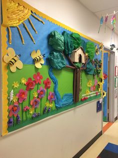 a classroom hallway decorated with paper flowers and trees