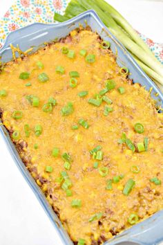 a casserole dish with asparagus and cheese on the side, ready to be eaten