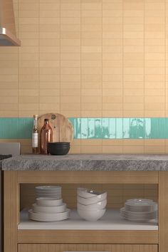 a kitchen counter with plates and bowls on it