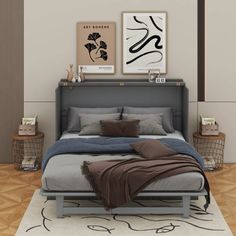 a bed sitting on top of a wooden floor next to two pictures hanging above it