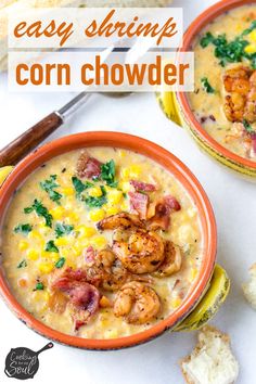 two orange bowls filled with corn chowder and shrimp on top of toasted bread