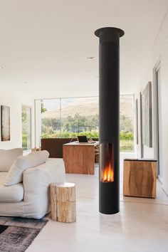 a living room filled with furniture and a fire place