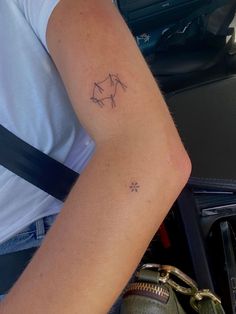 a person with a small tattoo on their arm