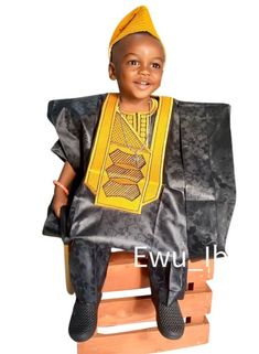 Three-piece African Brocade/Cotton Boys' outfit for birthdays, weddings, school cultural events, photo shoot and other special events. This listing/set includes pants/sokoto, top/buba, and a robe/agbada. Colors: Gold embroidery on black brocade. This listing is a complete traditional outfit worn by the Yoruba people of Nigeria who are known for their rich cultural heritage. Features: Loose Top/Robe Elasticated loose/fitted pants Rich Embroidery Comfortable hat Contact us for a group or family or Embroidery On Black, Yoruba People, Loose Fitting Pants, Fitted Pants, Traditional Outfit, African Clothing For Men, Loose Top, Cultural Events, Gold Embroidery