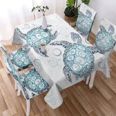 a dining room table covered in blue and white turtles