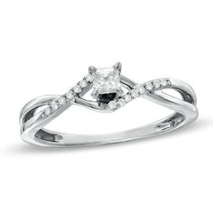 a white gold ring with a square cut diamond in the center