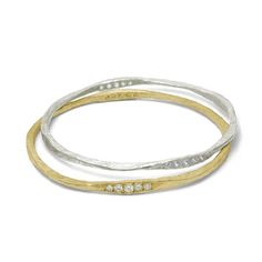 With an undulating texture and form that simmer delicately in the light, our 18k Gold 10 Stone Hammered Bangles with Diamonds - worn solo or stacked - has an allure all its own. The form of this bangle undulates with four flattened sections, two of which have five stones that shimmer in the light. Breathing and etherial. This listing is for one 18k Gold Bangle with 10 White Round Brilliant Cut Diamonds - VS1, F-G Color, Approximate total diamond weight .70 Carat Size: 2 1/2" diameter For additio Luxury Elegant Hammered Bangle, Bangle With Diamonds, 18k Gold Bangle, Hammered Bangles, Hammered Gold, Gold Cuffs, Gold Bangle, Sterling Silver Bangles, Silver Bangle