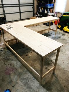 a wooden bench sitting inside of a garage