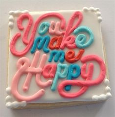 a decorated cookie with the words make me happy on it