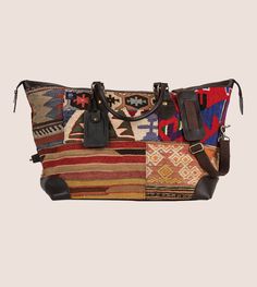 Kilim Weekender Bag - RES IPSA Multicolor Rectangular Bag With Leather Trim, Vintage Travel Bag With Leather Handles For Weekend Trips, Vintage Duffle Bag With Adjustable Strap For Travel, Brown Weekender Bag With Leather Trim For Trips, Leather Trim Duffle Tote Bag For Trips, Vintage Rectangular Weekender Bag For Weekend Trips, Brown Leather Trim Weekender Bag For Trips, Overnight Trips Tote Shoulder Bag With Leather Handles, Leather Handled Tote For Overnight Trips