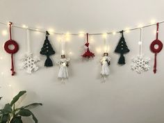 christmas decorations are hanging on the wall