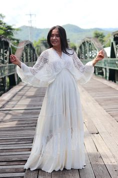 All items are shipped to Thailand Post. Free upgrade to D.H.L Express when you but 2 or more. The USA only. Made from 100% natural cotton. Color is a slightly off-white creamy color. This beautiful full maxi dress and half lined in the same material. V-neck neckline made in lace and back with solid material Three quarter length sleeves in machine lace finished with a double layered cuff The second last tier is made of machined lace brings the dress together from top to bottom Empire waist adding Bohemian Long Sleeve Maxi Dress For Wedding, Bohemian Long Sleeve Maxi Wedding Dress, Bohemian Long Sleeve Wedding Maxi Dress, White Bohemian Lace Maxi Dress, Bohemian Long Sleeve Lace Maxi Dress, White Lace Bohemian Maxi Dress, White Flowy Lace Boho Dress, White Lace Flowy Boho Dress, Off White Bohemian Cotton Dress