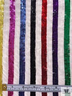 Bring the party with this multicolor and white rainbow striped sequins on silk crepe de chine designer fashion fabric. SKU: 12303 Content: 100% Silk Color: Multicolor / White Width: 44 inches Multicolor Glitter Sequin Fabric For Summer, Summer Multicolor Glitter Sequin Fabric, Multicolor Glitter Sequin Fabric For Party, Multicolor Glitter Sequin Fabric For Party Season, Multicolor Sequin Fabric For Festive Party Season, Festive Multicolor Contrast Sequin Fabric, White Rainbow, Silk Crepe, Rainbow Stripes