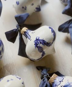 blue and white ornaments with bows on them