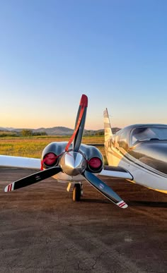 an airplane is parked on the tarmac with its wings folded down and it's wheels still attached