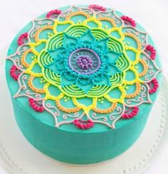 a cake decorated with an intricate design on a plate