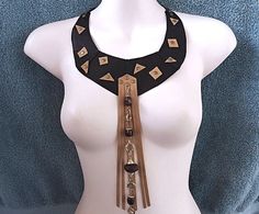 A unique tribal choker to complete your boho style outfit ! *DESIGN* A black genuine  leather choker with tan leather fringe  and  beaded chain. 2 leather ties at the ends for an adjustable fit. *SIZE* free neck size  10 inch length from the middle front  ..   26 cm ** international shipping at letter rate, with no tracking. Upgrades available at checkout. earthy Boho style Thanks for looking, Kathy Adjustable Boho Collar Necklace For Festivals, Brown Bohemian Necklaces For Party, Brown Festival Choker Jewelry, Brown Choker For Festival, Unique Handmade Brown Choker, Bohemian Style Brown Necklace For Party, Brown Bohemian Party Necklaces, Brown Bohemian Party Necklace, Hippie Brown Jewelry For Festivals