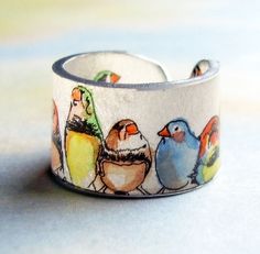 a bracelet with birds painted on it