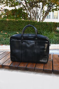 Genuine Leather Briefcase made by Agni, in Ulaanbaatar, Mongolia. This luxurious goat leather briefcase features a classic glossy finish, two handles and an adjustable long strap for easy carrying. The bag is also equipped with a front zipper closure and two external pockets secured with magnetic closures. Size (LxHxW)- 15 x 11 x 3 Luxury Leather Briefcase With Leather Strap, Luxury Leather Briefcase For On-the-go, Luxury Briefcase With Zipper Pocket, Luxury Glossy Finish Bags, Luxury Leather Briefcase With Zipper Pocket, Luxury Briefcase For On-the-go, Luxury Leather Briefcase With Adjustable Handle, Classic Luxury Briefcase, Luxury Bridle Leather Briefcase For Business