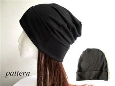 a woman's head wearing a black beanie hat