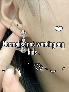 a girl with ear piercings that says normalise not wanting any kids's