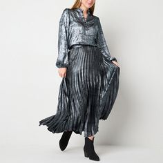 Get ready for parties or other special occasions with this Ryegrass women's pleated skirt in an icy blue metallic color that adds an eye-catching element to your look. Crafted from satin, it features a mid-rise, a long length, and a button and zipper closure on the side. Pair it with a silky blouse and ankle boots. Front Style: Pleated FrontClosure Type: Button, ZipperClosure Location: Right SideRise: Mid RiseApparel Length: 43 InchesFiber Content: 96% Polyester, 4% SpandexFabric Description: S… Pleated Skirt Blue, Long Pleated Skirt, Skirts Pleated, Womens Pleated Skirt, Pleated Long Skirt, Pleated Skirts, Silky Blouse, Icy Blue, Metallic Colors