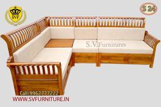 a wooden couch with white cushions on it's sides and the words sv furniture written below