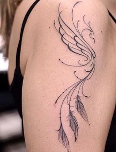 a woman with a tattoo on her shoulder