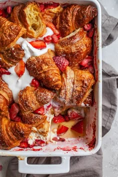 strawberry croissants with cream and strawberries in a casserole dish