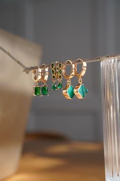 Elegant Green Emerald Dangling Zircon Hoop Earrings 18K Gold Plated Nickel Free Hypoallergenic Dangling Earrings Delicate and elegant in style. Great for gifting. Perfect for special occasions or everyday wear. Pair these earrings with our emerald gold necklace  https://www.etsy.com/ca/listing/1663196784/emerald-green-gold-necklace-may?click_key=8aa688bbc06523bdb0927672b4ea194b891f2305%3A1663196784&click_sum=b2c9238f&ref=shop_home_active_2&pro=1&frs=1 EARRING DETAILS Hoop diameter: 16mm Zircon H Hypoallergenic Gold Plated Green Jewelry, Hypoallergenic Green Gold-plated Jewelry, Green Dangle Jewelry With Plating, Elegant Green Dangle Huggie Earrings, Gold Emerald Huggie Earrings Gift, Green Hoop Gold-plated Jewelry, Gold Emerald Hoop Earrings For Gift, Green Dangle Hoop Earrings For Wedding, Green Hoop Jewelry For Weddings