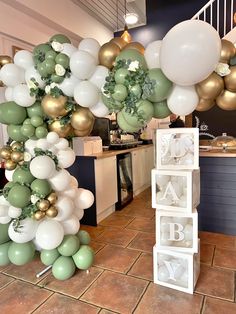 balloons and letters are on display in a room