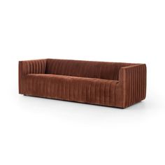 a brown couch sitting on top of a white floor