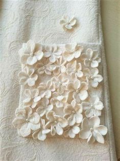 a white towel with some flowers on it