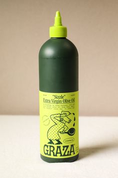 a bottle of extra virgin olive oil sitting on a table